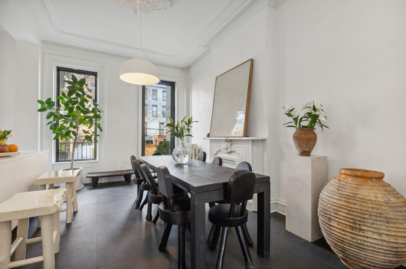 Extra large dining room with heated bluestone floor and original plaster ceiling moldings and center medallions